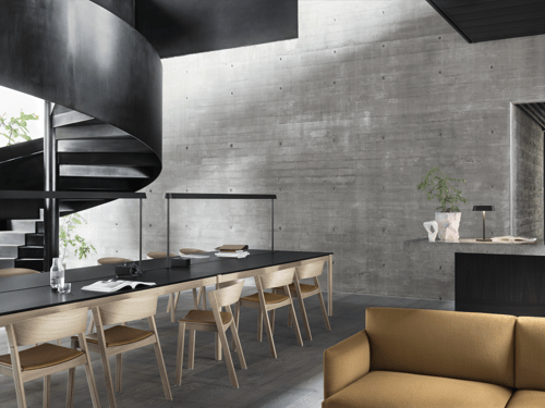 Linear System Table Configuration 2 w. Black Linoleum, Linear Mounted Lamp in Black, Linear Table Lamp in Black, Cover Side Chair in Oak/Cognac Refine Leather, Outline Studio Sofa in Vidar 472