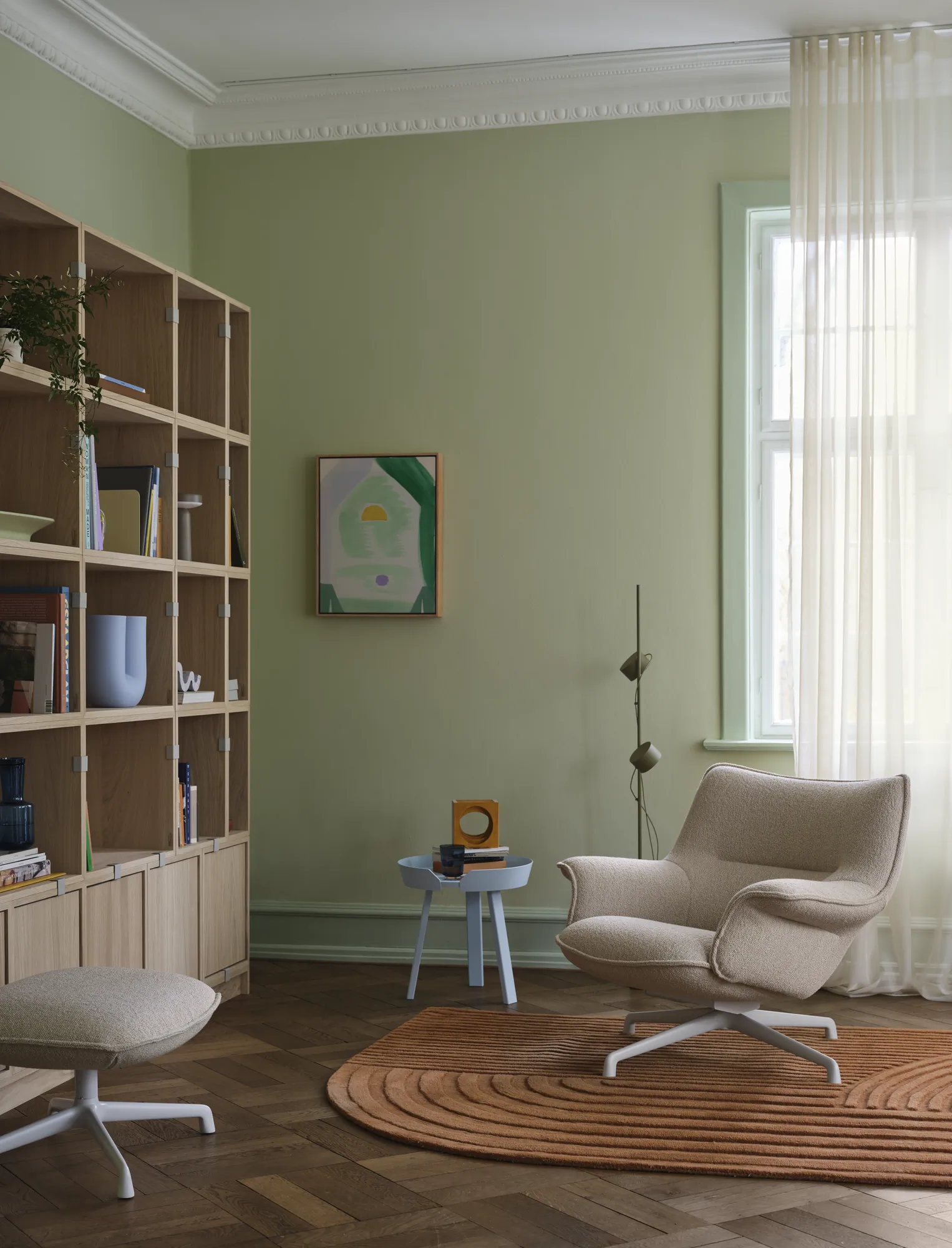 Doze Lounge Chair Low Back & Ottoman Swivel Base in Hearth 7/Grey - Stacked Bookcase Configuration 1 in Oak - Relevo Rug in Burnt Orange - Post Floor Lamp in Brown Green
