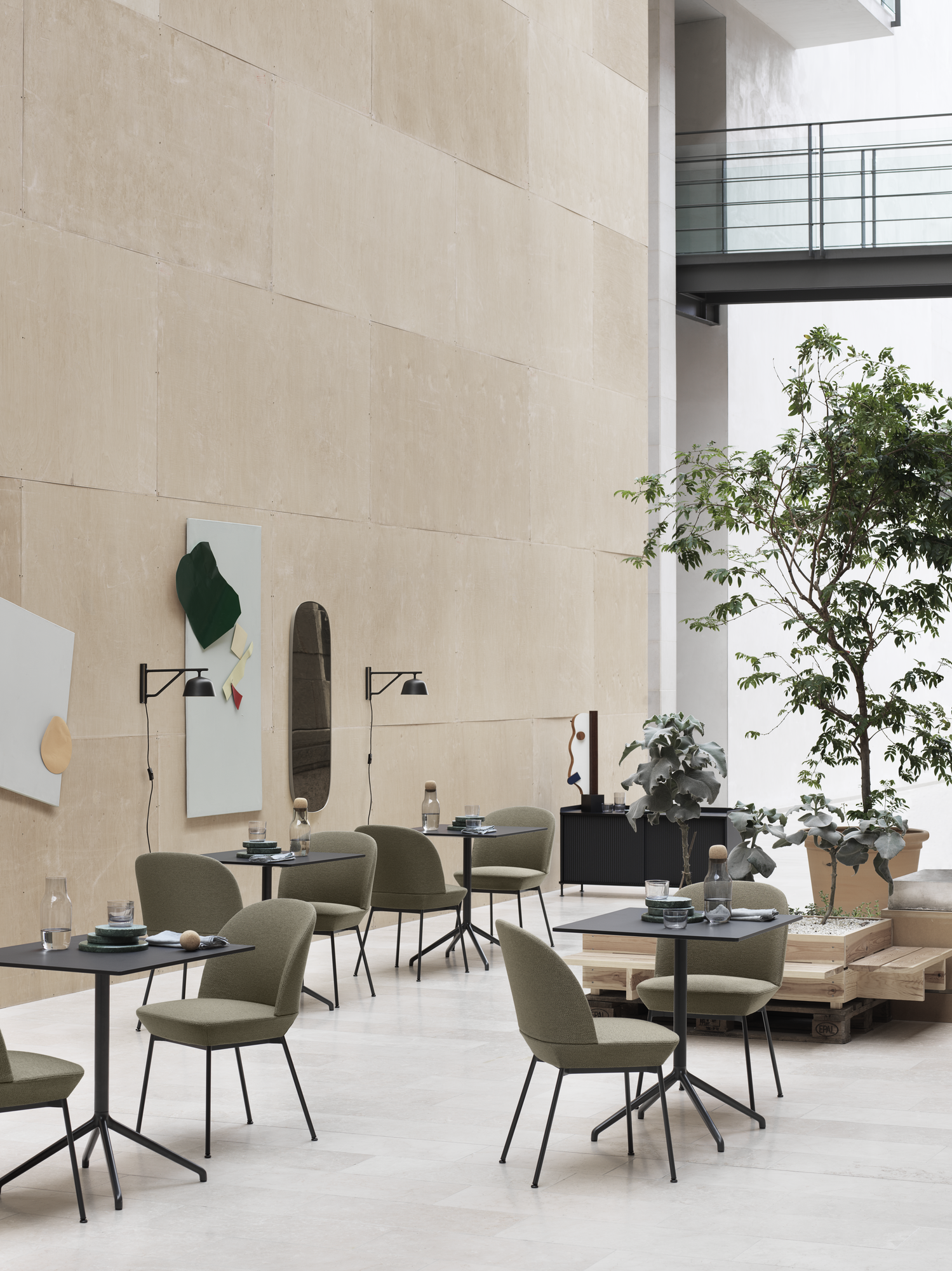 Oslo Side Chair Ocean 21/Anthracite Black, Still Café Table 75 x 65 H:73 Black/Black, Ambit Wall Lamp Black, Corky Carafe