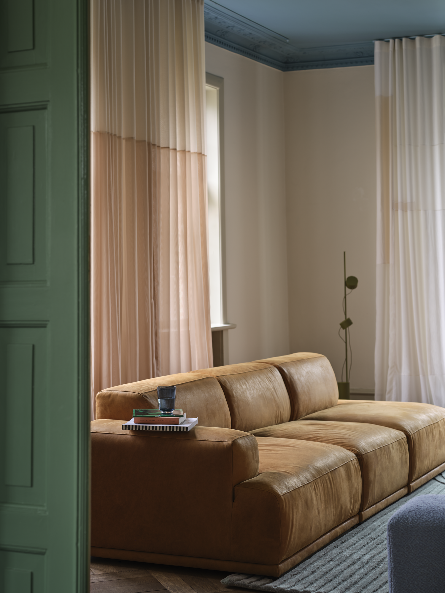 Connect Soft Modular Sofa in Grace Leather Cognac - Relevo Rug in Sage Green - Post Floor Lamp in Brown Green - Echo Pouf in Hearth 12