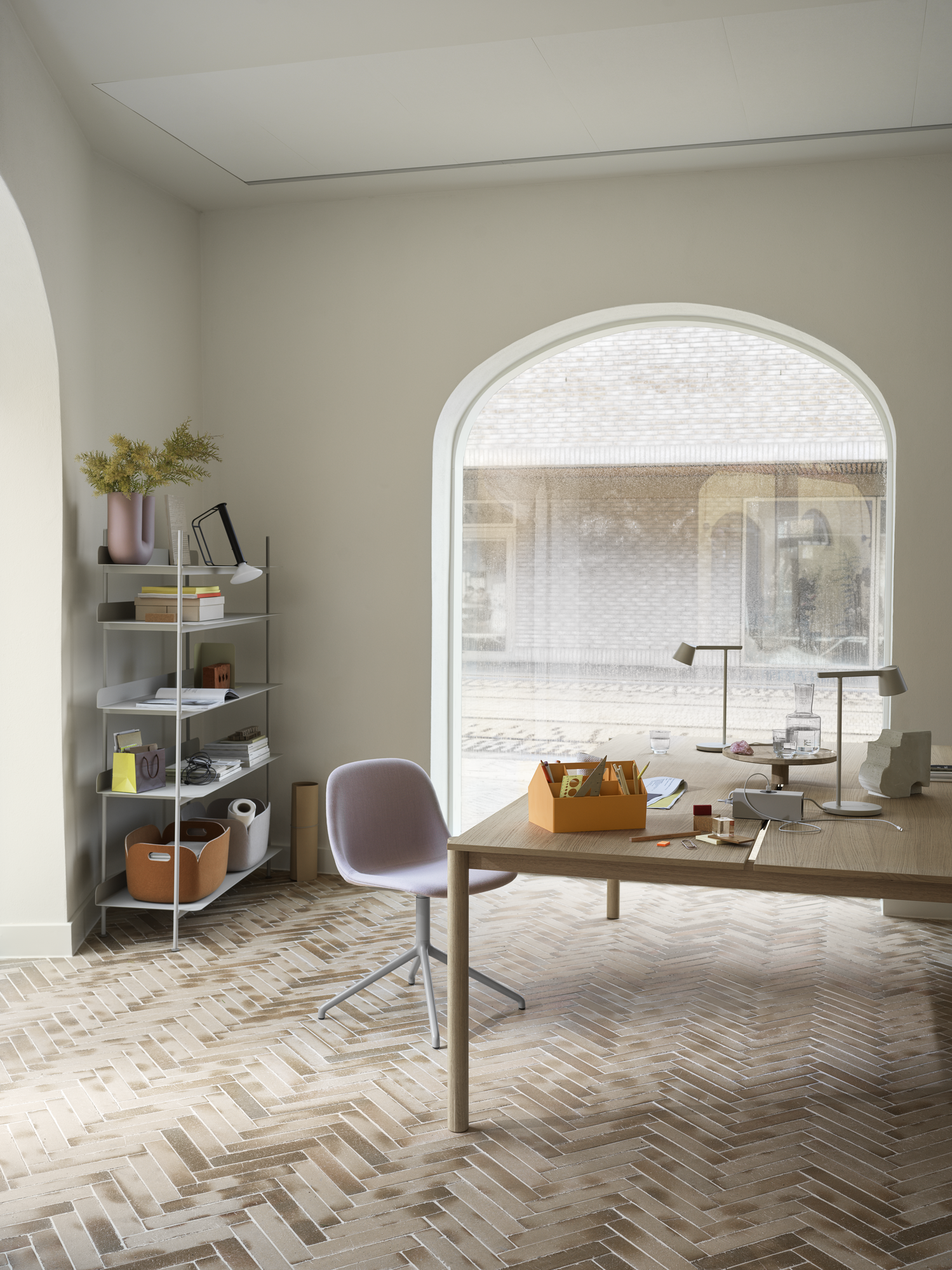Sketch Toolbox in Burnt Orange - Fiber Side Chair w. Grey Swivel Base in Twill Weave 620 - Linear System Table in Oak - Tip Table Lamp in Grey - Piton Portable Lamp in Black