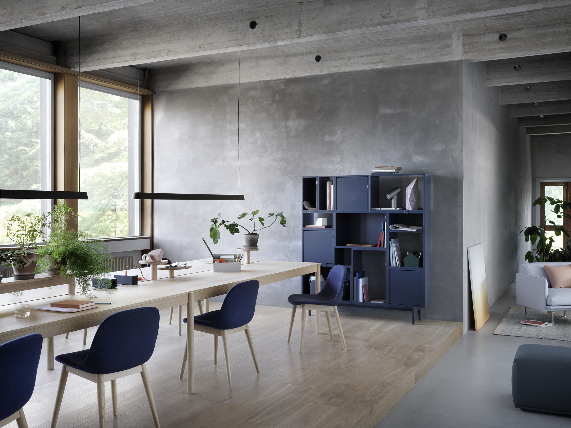 Linear System Modular Table Configuration 3 in Oak, Linear System Trays, Linear Mounted Lamp, Fiber Side Chair Wood Base in Oak & Twill Weave 780, Stacked Shelving Storage Configuration 6