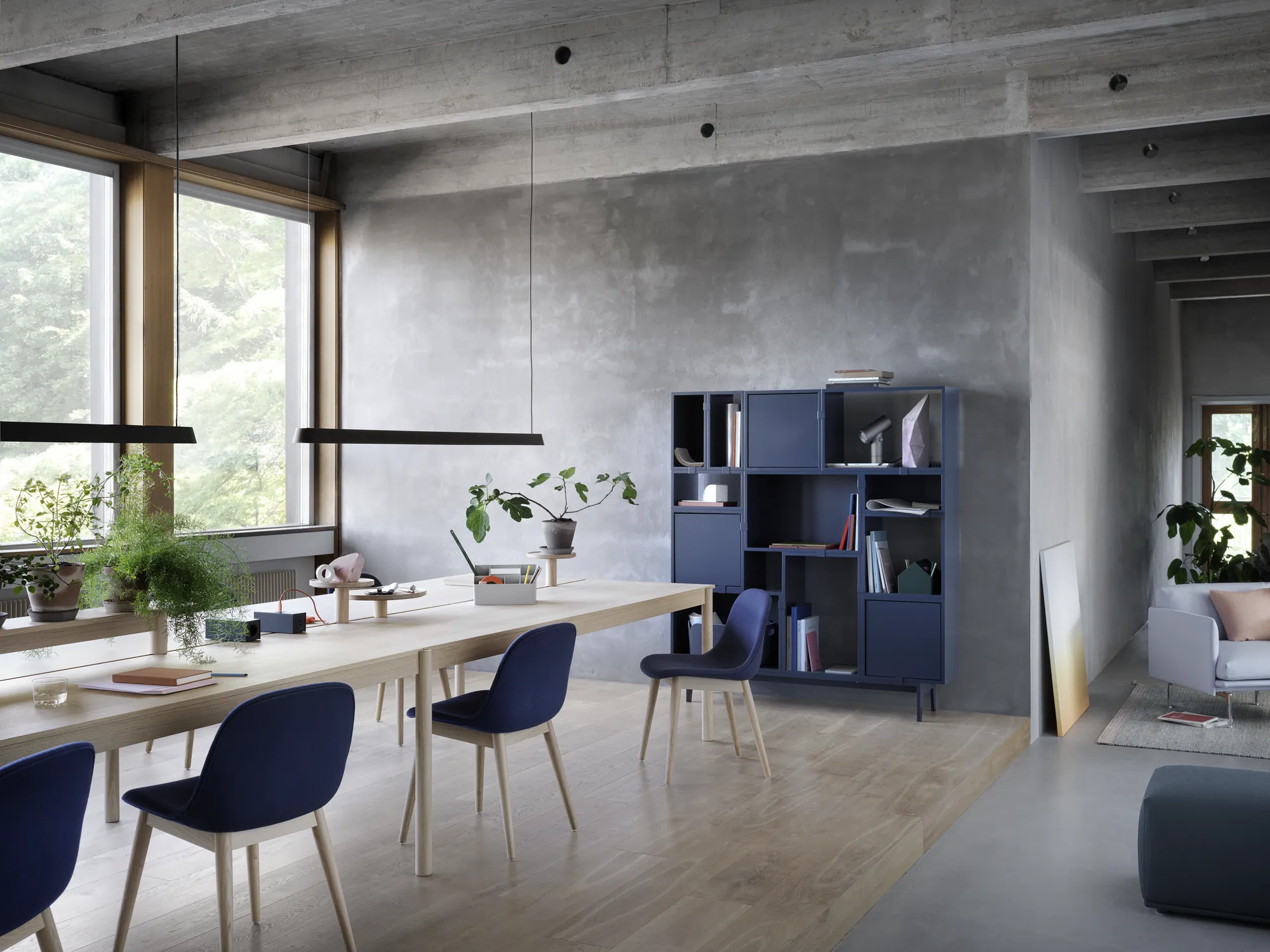 Linear System Modular Table Configuration 3 in Oak, Linear System Trays, Linear Mounted Lamp, Fiber Side Chair Wood Base in Oak & Twill Weave 780, Stacked Shelving Storage Configuration 6