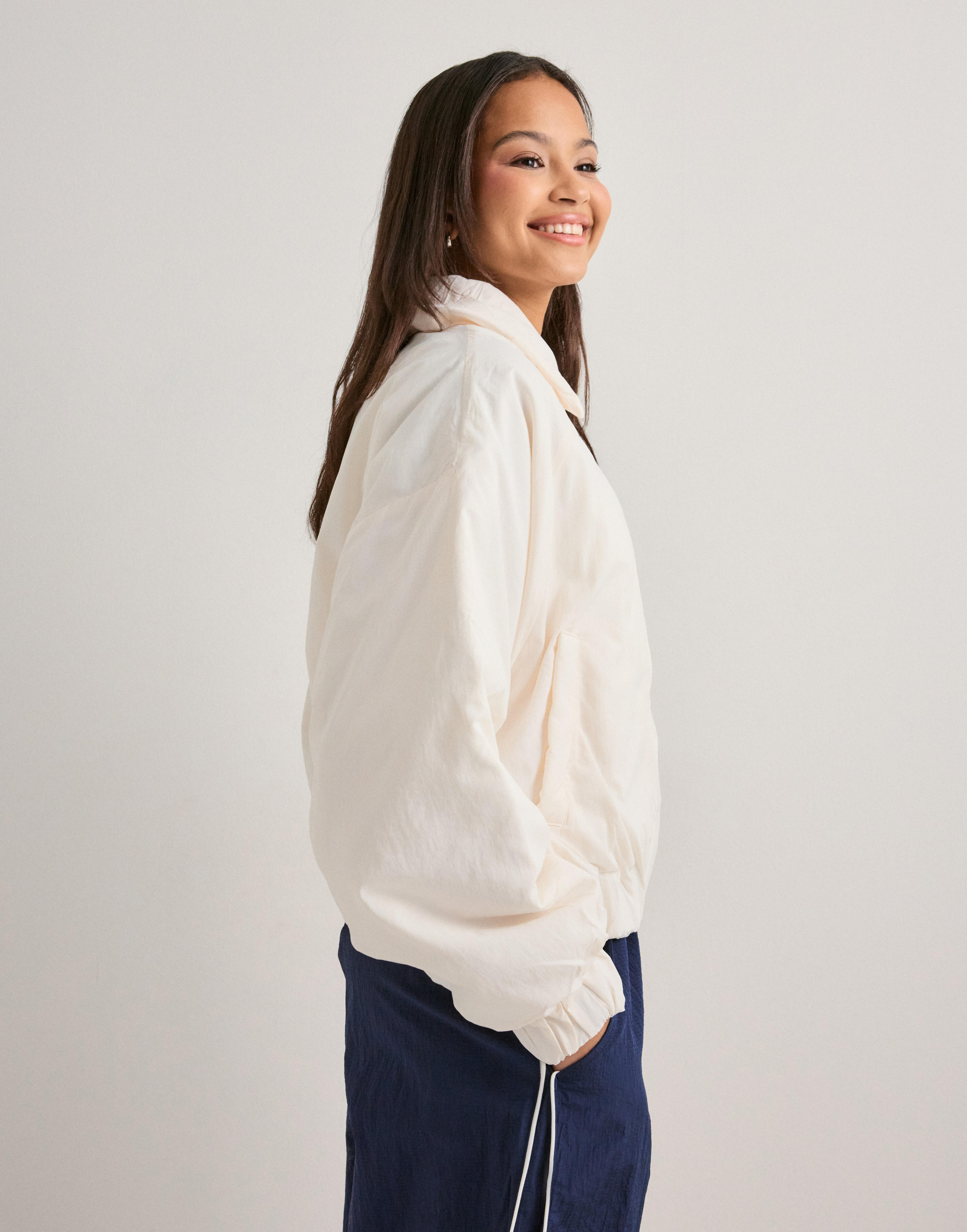 Buy New Balance Woven Bomber Jacket - Sea Salt | Nelly.com