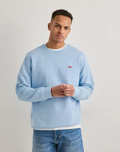 Blå sweatshirt från Levi's i chambrayton med logga och rundad hals