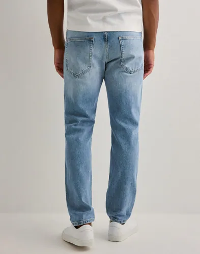 Blå tapered jeans från Only & Sons med slim fit och femficksmodell