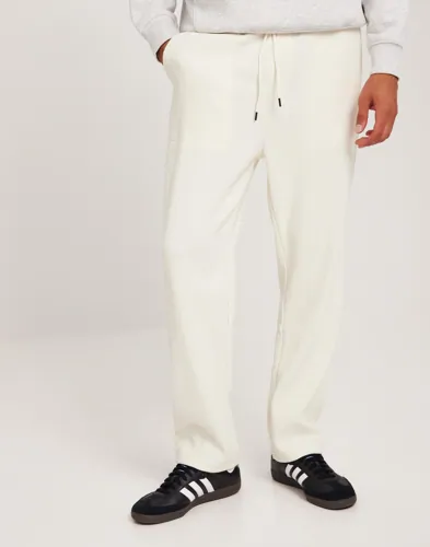 Jack & Jones beige plisserade mjukisbyxor för herr med resårmidja