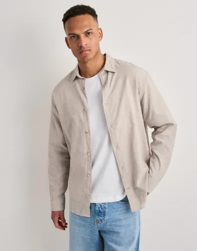 Beige linneskjorta från Jack & Jones med knappar framtill