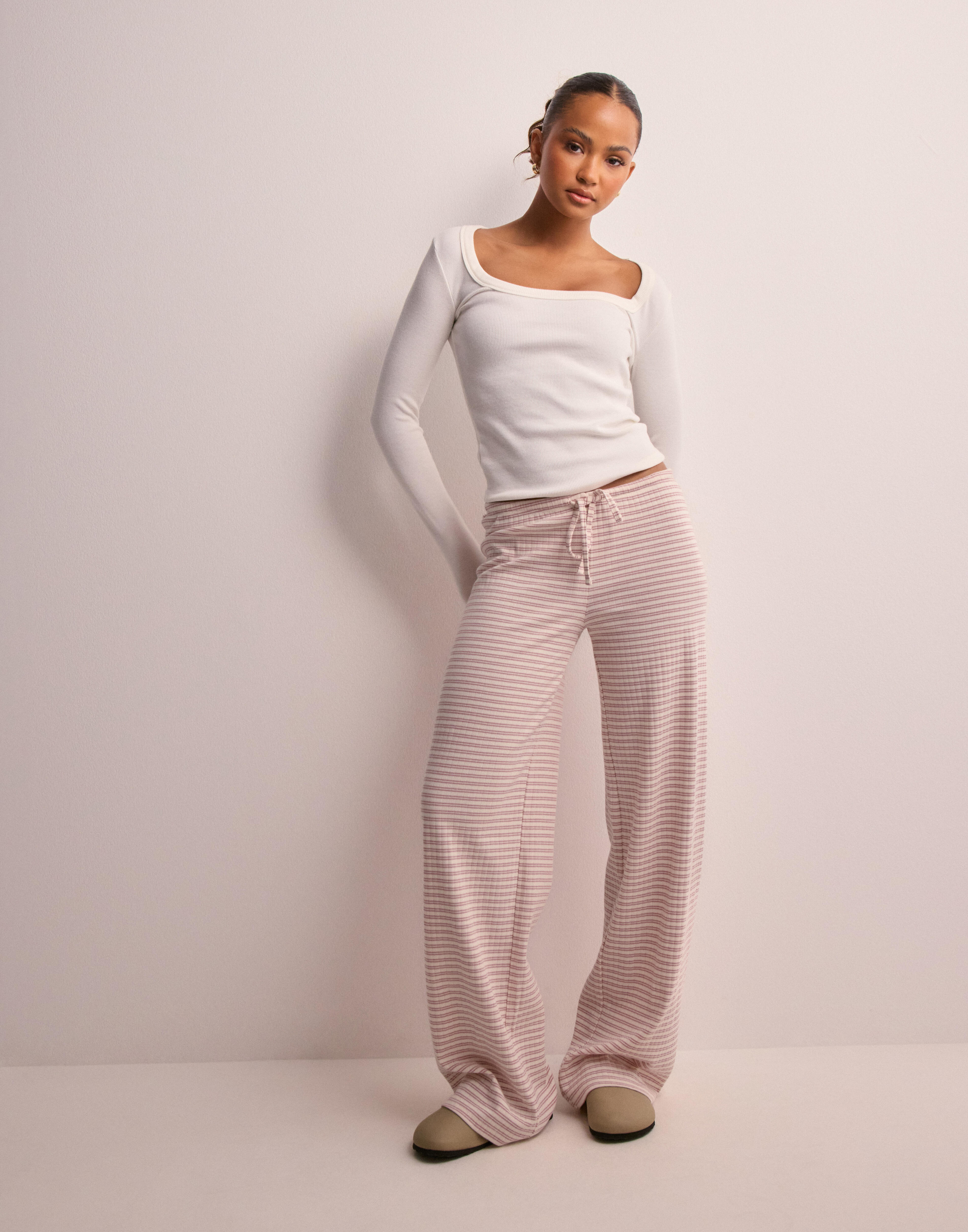 Pink striped pants best sale