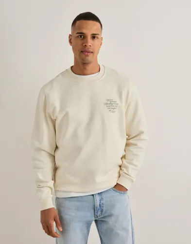 Beige Les Deux Ben sweatshirt med rund hals och tryck på bröstet