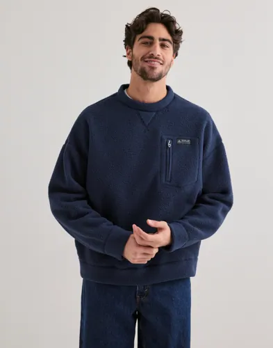 Blå pullover från Polo Ralph Lauren med bröstficka