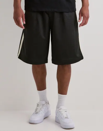 Woodbird Chang track shorts i svart med revärer och logga