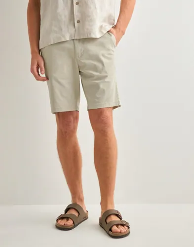 Beige slim-shorts från Selected med sidofickor
