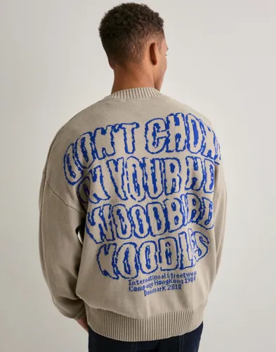 Beige stickad tröja från Woodbird med rundad hals och ribbade muddar
