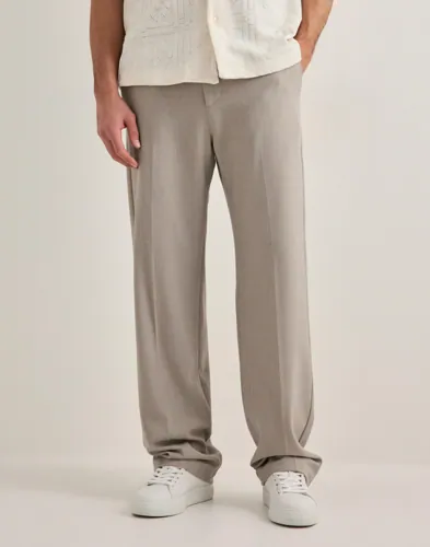 Les Deux Como kostymbyxa i beige med raka ben och pressveck