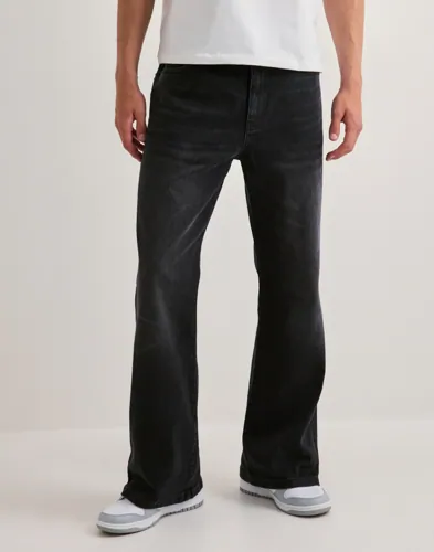 Woodbird svarta Leroy flare jeans för herr med utsvängda ben