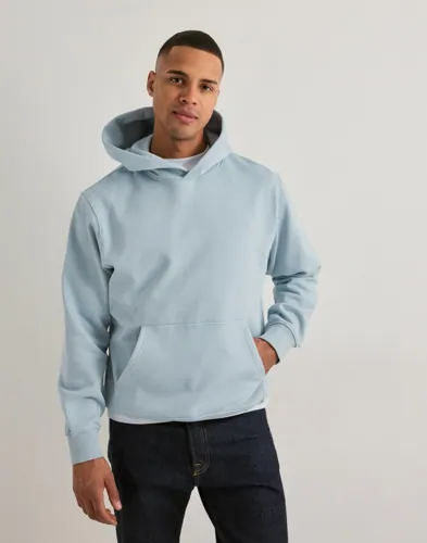 Blå Jack & Jones hoodie i oversize-passform med ficka framtill