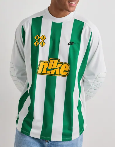 Nike vit fotbollströja med vadderade armbågar och tryck framtill
