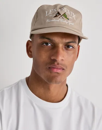 Beige twillkeps från Les Deux med broderad logga fram