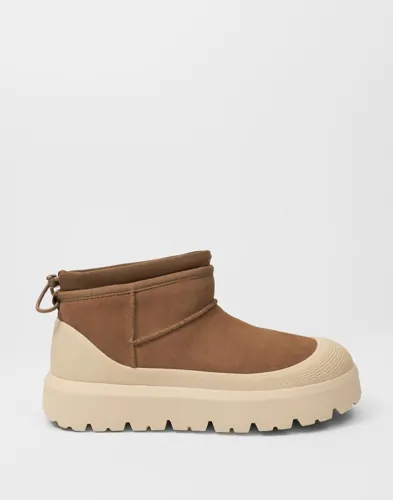 UGG Classic Ultra Mini bruna boots i mocka med dragsko baktill