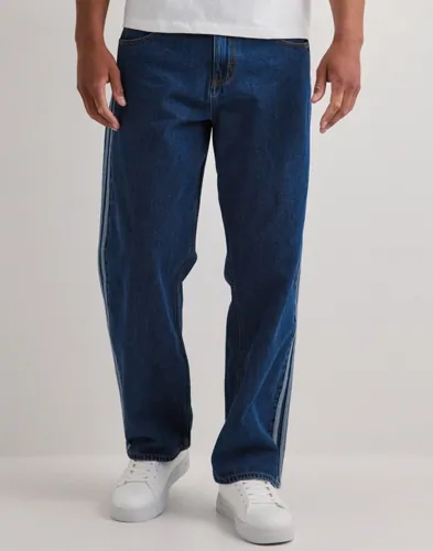 Blå Adidas Originals Firebird byxor med revärer längs sidorna