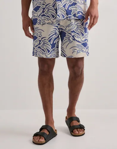Blå linneshorts från OAS med dragsko i midjan och sidofickor