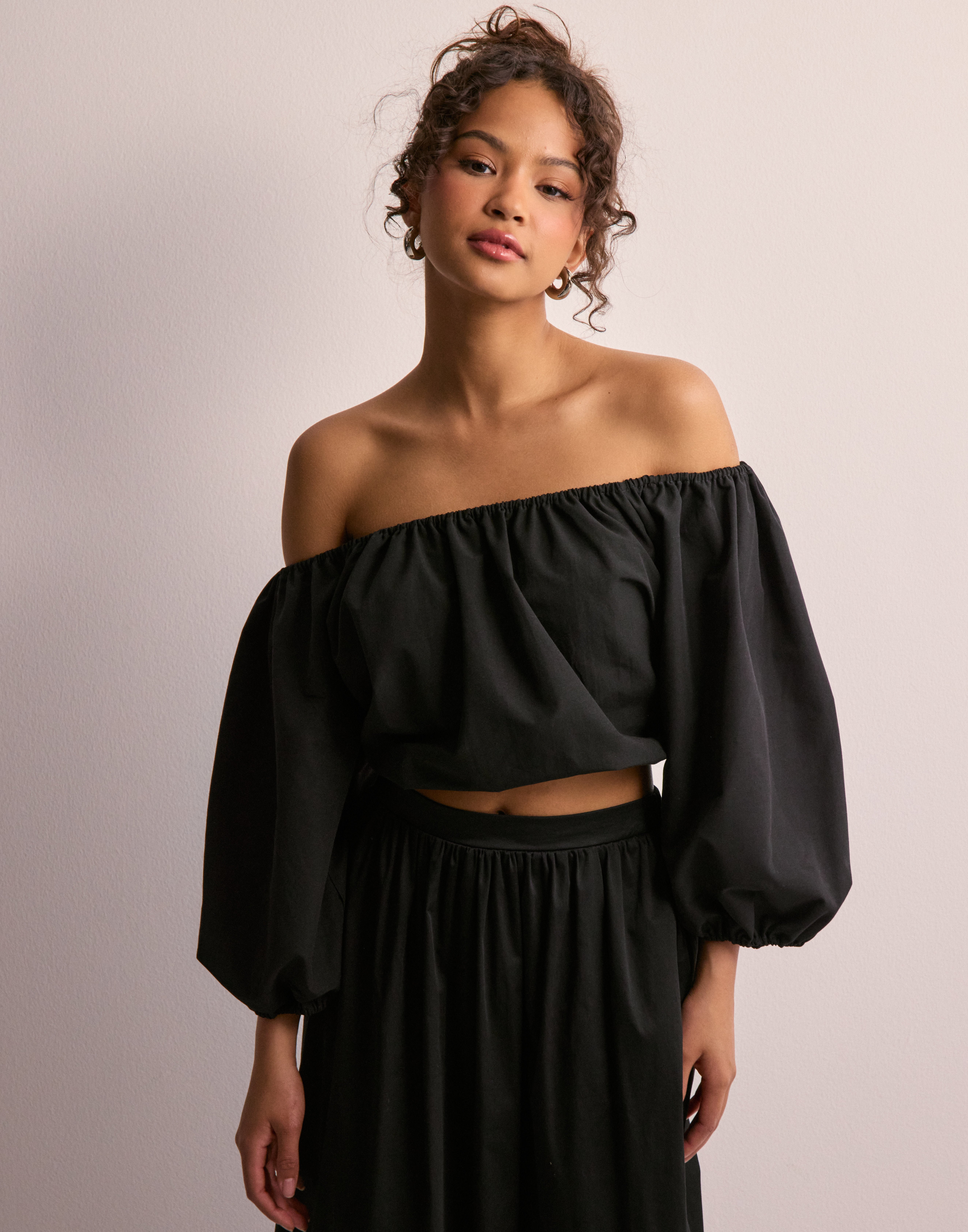 off the shoulder black top 3 4 sleeve