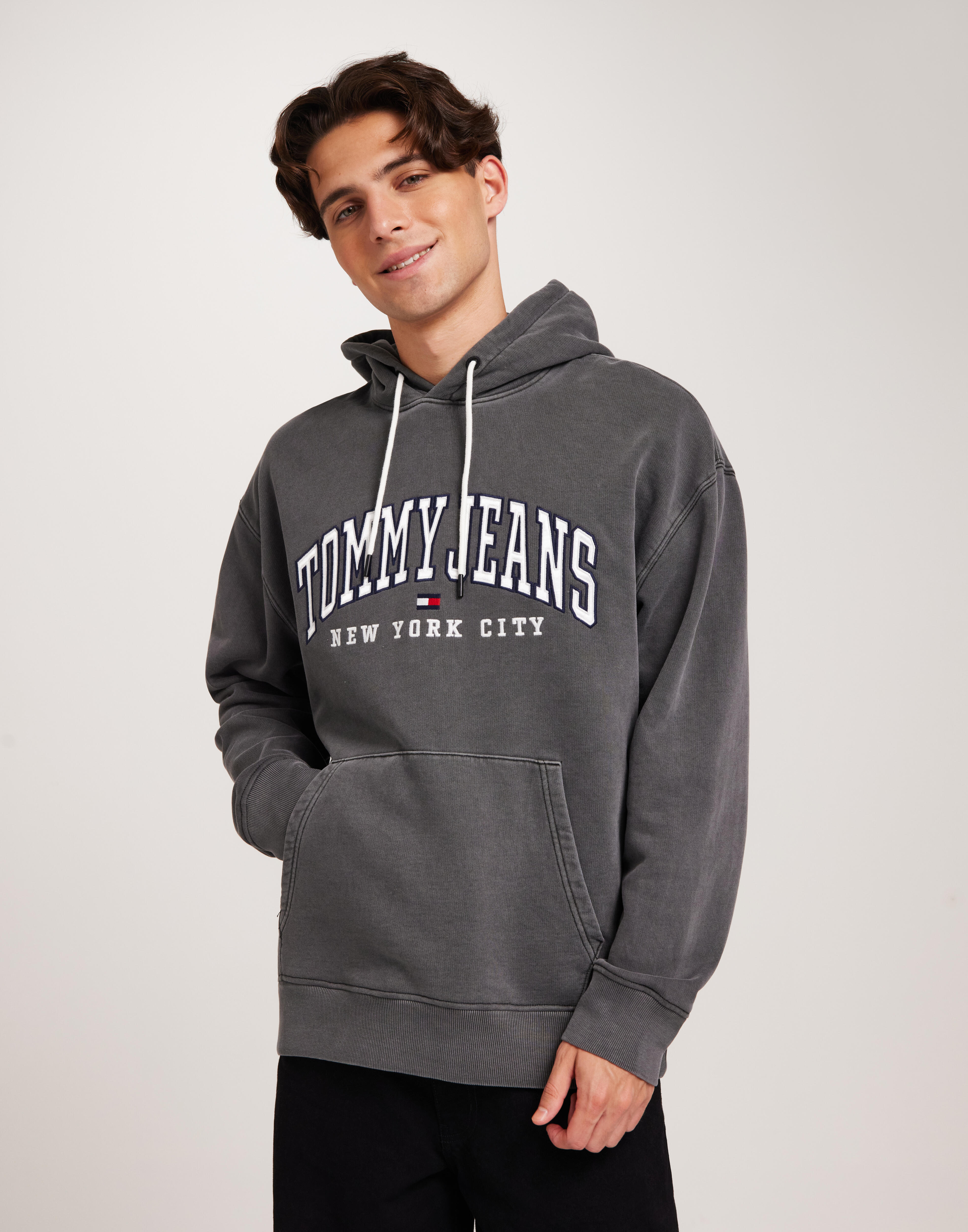 Buy Tommy Jeans TJM RLX GD VARSITY HOODIE - Black | NLYMAN