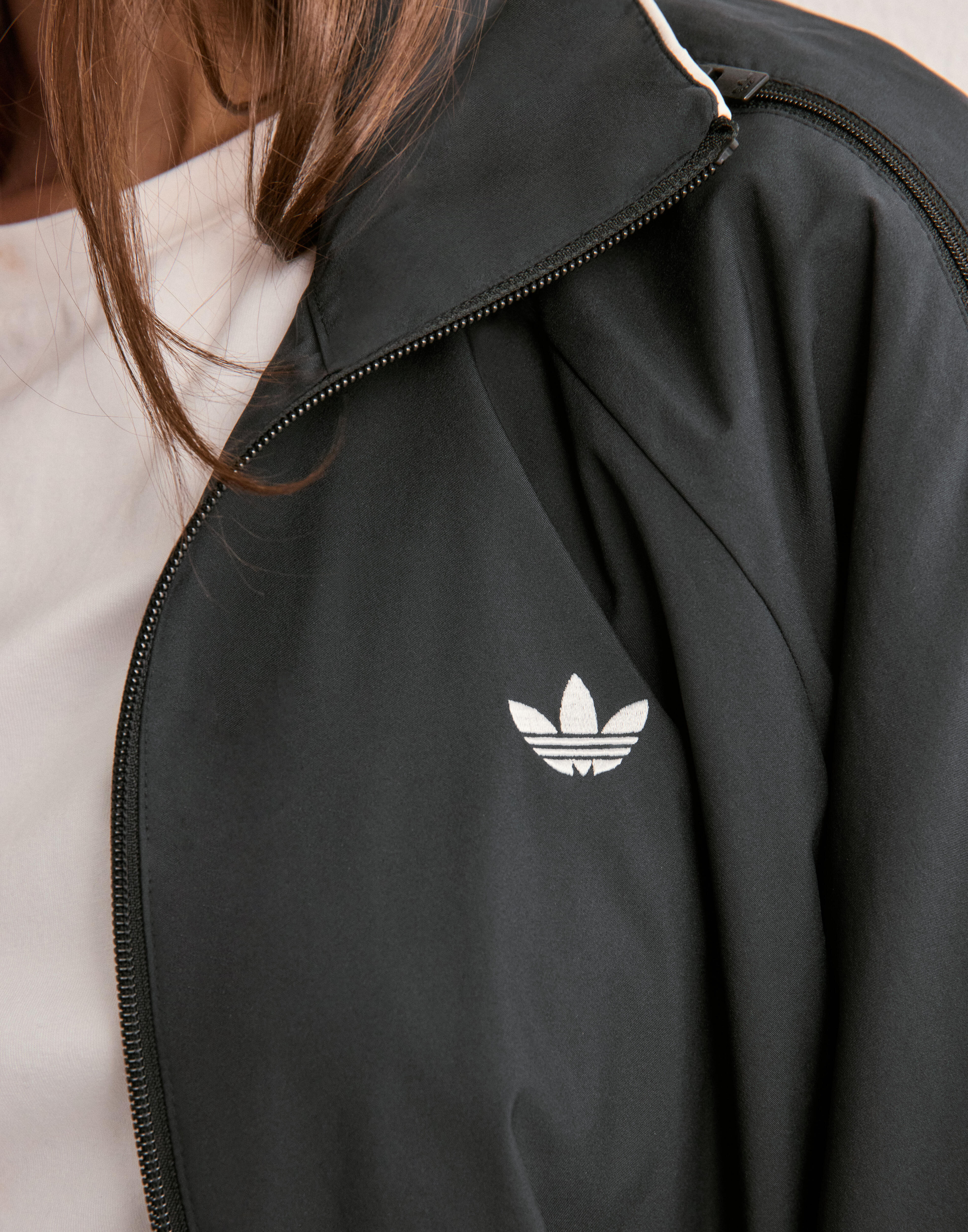 Buy Adidas Originals WOVEN TT ZIP - Black | Nelly.com