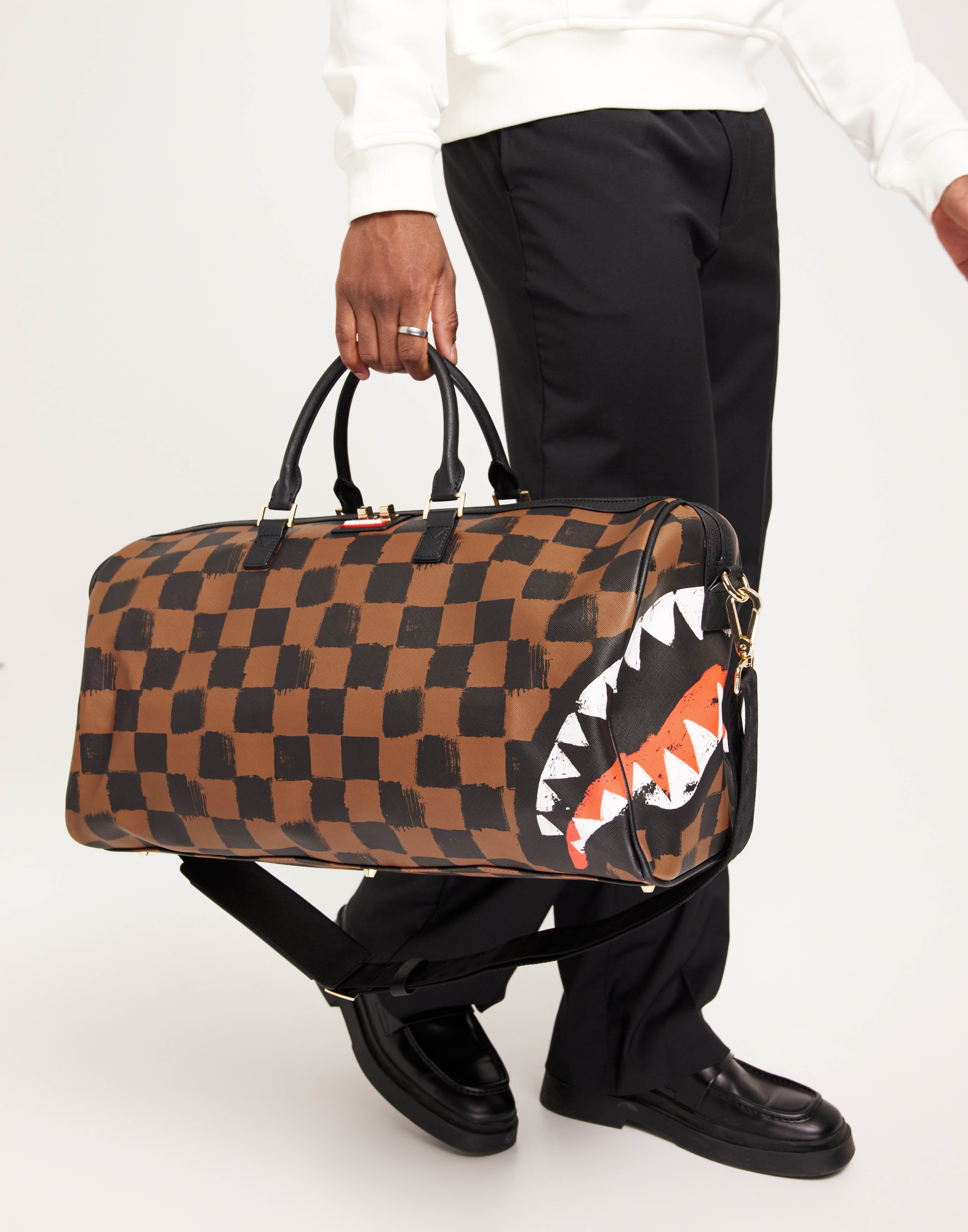 Buy Sprayground SHARKS IN PARIS PAINTED DUFFLE Black Brown NLYMAN