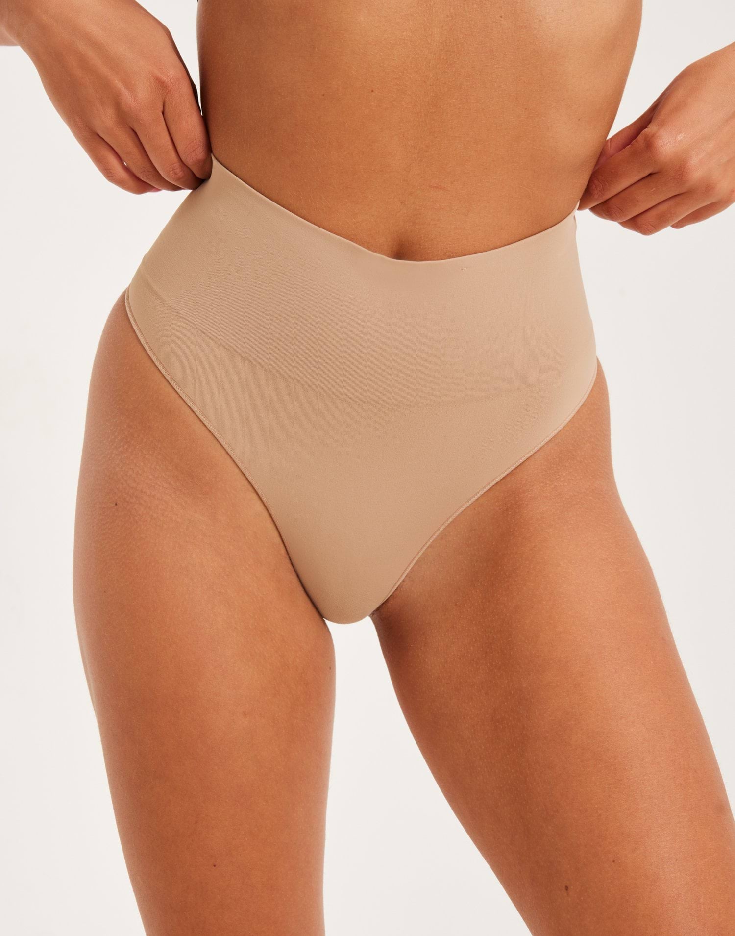 Buy Spanx EcoCare Seamless Shaping Thong - *NY*Toasted Oatmeal | Nelly.com