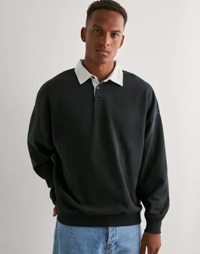 Svart långärmad Only & Sons rugbypiké med knäppt krage och oversize fit