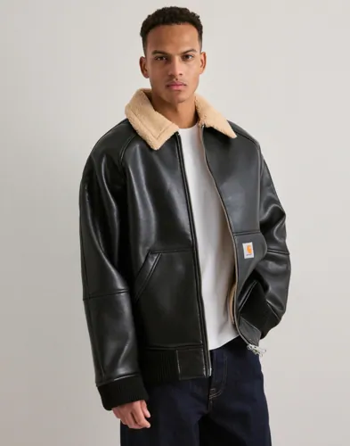 Svart Carhartt WIP Shepton jacka med teddyfleecekrage och dragkedja