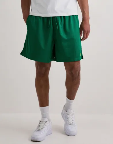 Gröna Nike Club Flow shorts med dragskomidja och broderad logga på benet