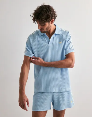 Blå kortärmad piké från Adidas Originals med krage