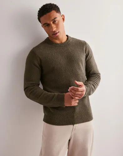 Grön sweatshirt från Samsøe Samsøe med ribbade muddar vid hals och nederkant