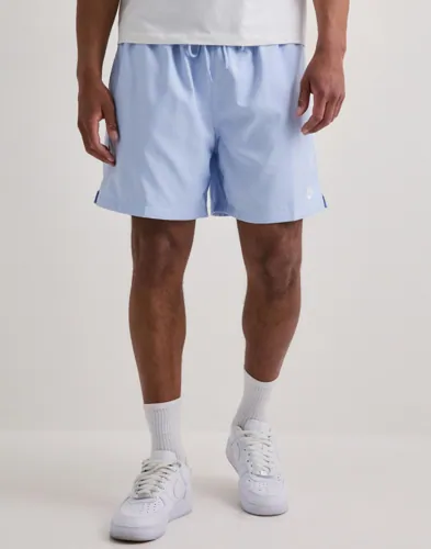 Nike Club Flow blå träningsshorts med resår och dragsko i midjan