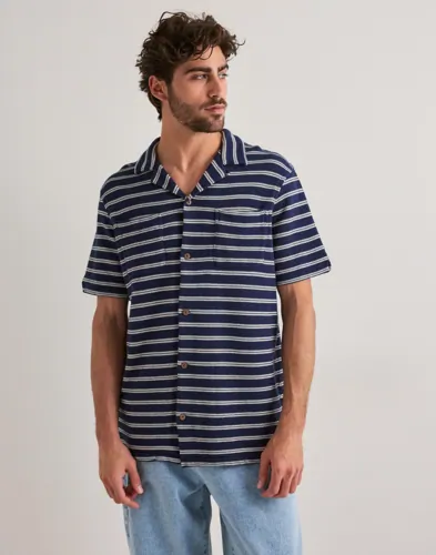 Blå kortärmad stickad skjorta från Polo Ralph Lauren med bröstficka