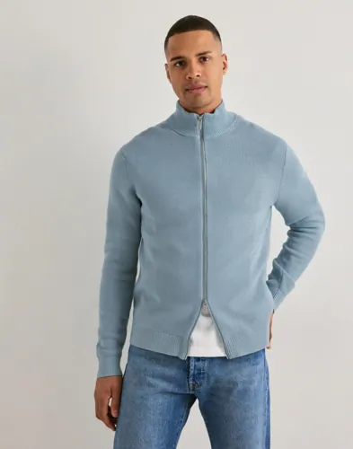 Blå stickad zip-tröja från Selected med hög krage och ribbade detaljer
